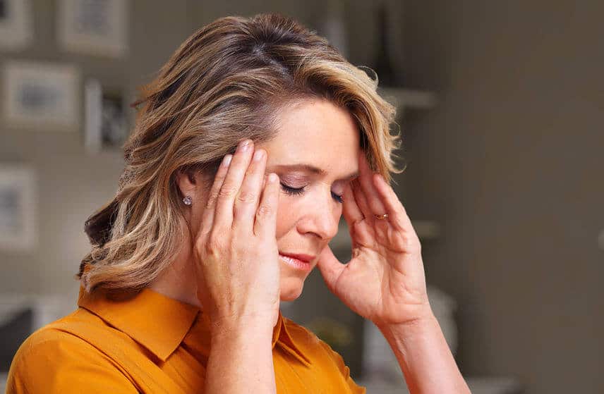 woman suffering from a migraine headache